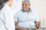 Senior African American man talking to his doctor