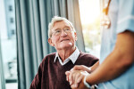 Senior man looking up at provider