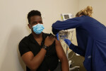 Aaron getting a COVID vaccine
